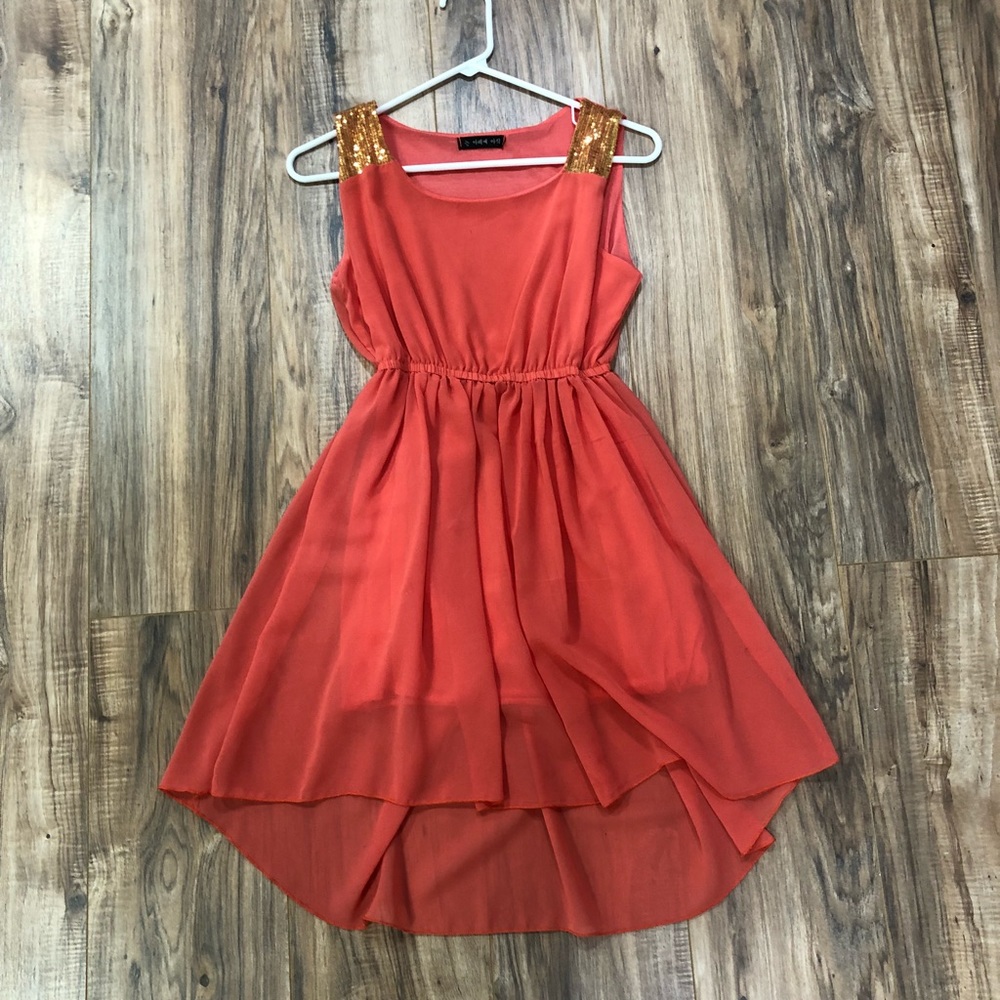 Orange hi-low dress with gold shoulder trim